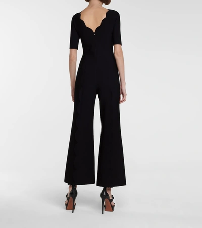 Shop Alaïa Stretch-knit Flared Jumpsuit In Black