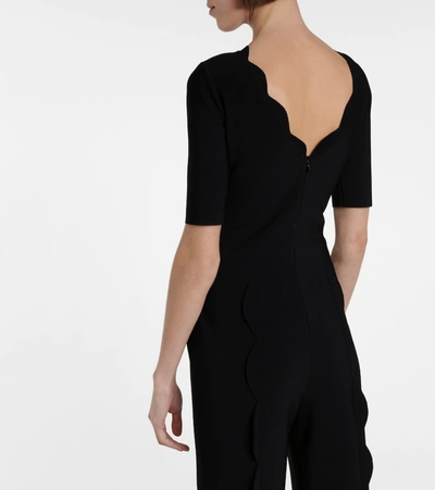 Shop Alaïa Stretch-knit Flared Jumpsuit In Black