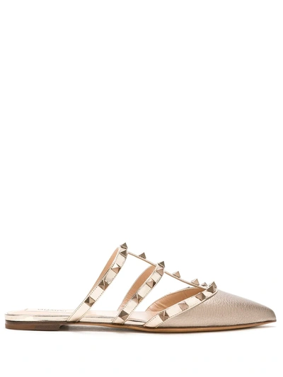 Shop Valentino Rockstud Slip-on Flat Mules In Gold