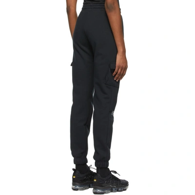 Shop Nike Black Sportswear Swoosh Lounge Pants In 010 Black/w