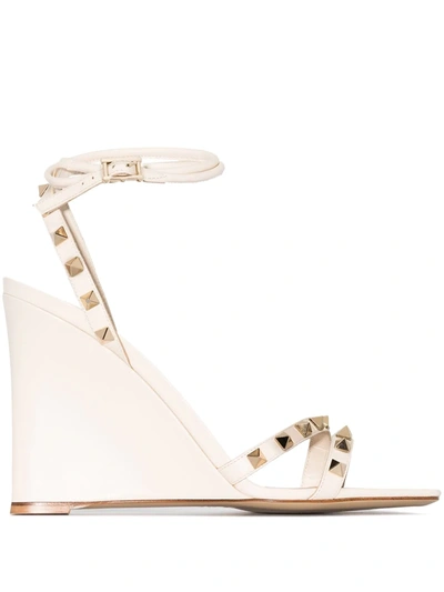Shop Valentino Rockstud 100mm Wedge Sandals In White