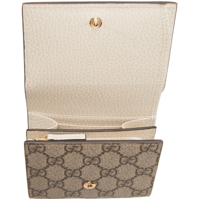 Shop Gucci Beige & Off-white Small Gg Supreme Marmont Flap Wallet In 9096 White/beige