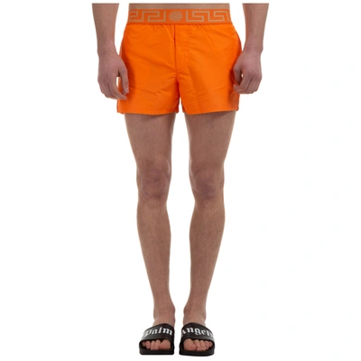 Shop Versace Trunks Swimsuit In Orange