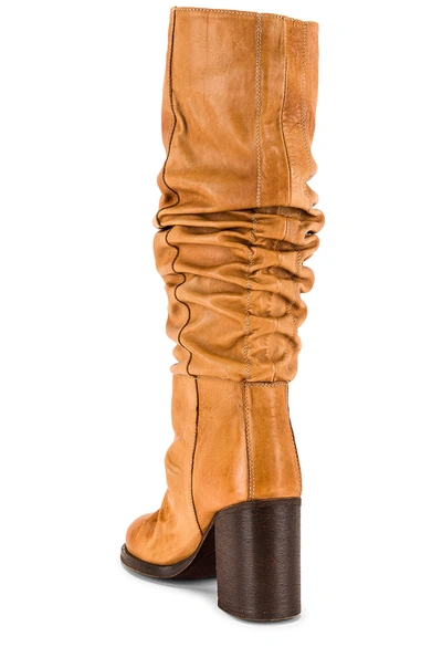 Shop Free People Tall Slouch Boot In Tan