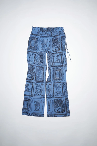 Shop Acne Studios Printed Trousers Indigo Blue