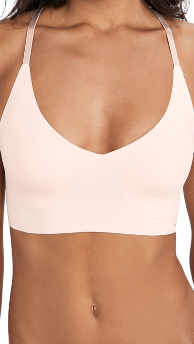 Shop Calvin Klein Underwear Invisibles Lace Lightly Lined Triangle Bralette In Nymph's Thigh 680