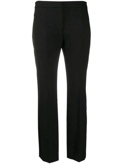 Shop Alexander Mcqueen Side Stripe Trousers In Black