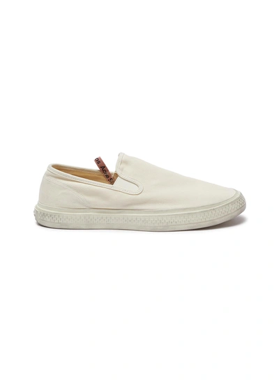 Shop Acne Studios Distressed Canvas Slip-on Sneakers In White
