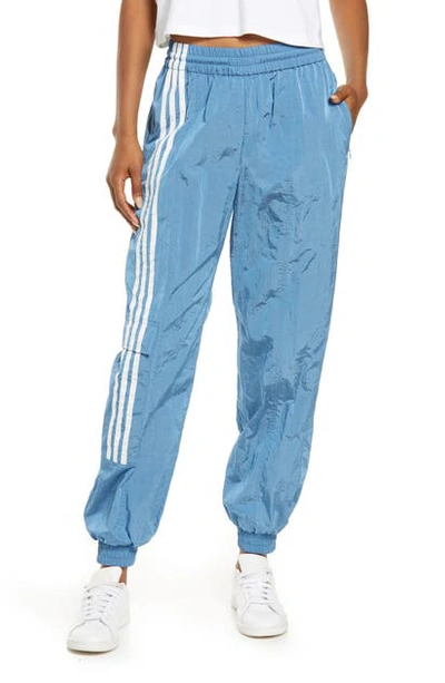 Shop Adidas X Ivy Park Unisex Nylon Track Pants In Light Blue