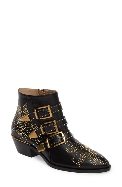 Shop Gucci Susanna Stud Buckle Bootie In Black Gold Leather