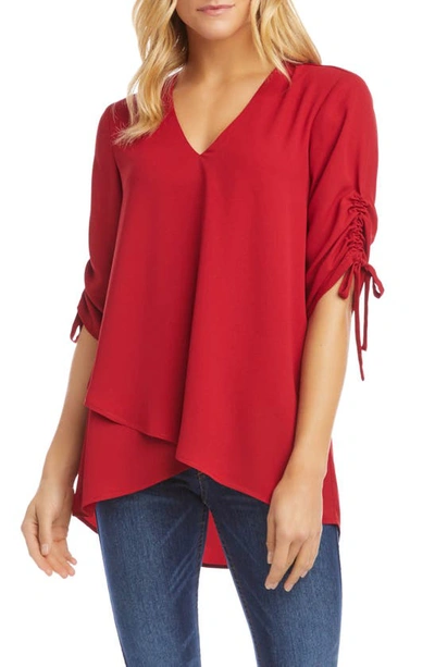 Shop Karen Kane Ruched Sleeve Asymmetrical Blouse In Red