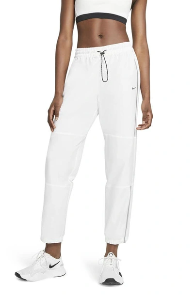 Shop Nike Pro Woven Pants In White/ Metallic Silver
