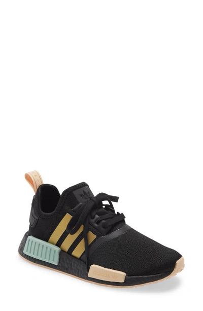 Shop Adidas Originals Nmd R1 Sneaker In Core Black/ Gold/halo Amber