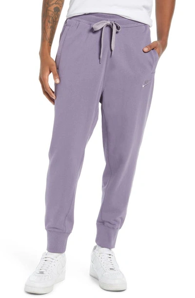 Shop Nike Sportswear Sweatpants In Daybreak/ Violet Haze