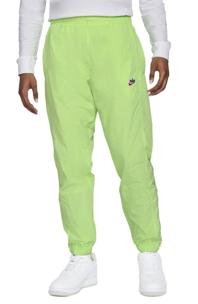 Shop Nike Sportswear Heritage Windrunner Track Pants In Key Lime