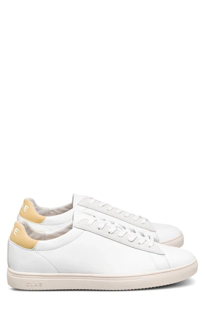 Shop Clae Bradley Sneaker In White Leather Pale Banana