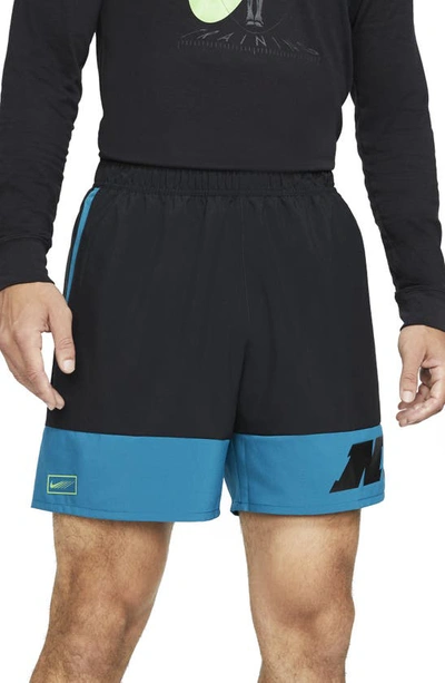 Shop Nike Sport Clash Dri-fit Training Shorts In Black/green Abyss/mean Green