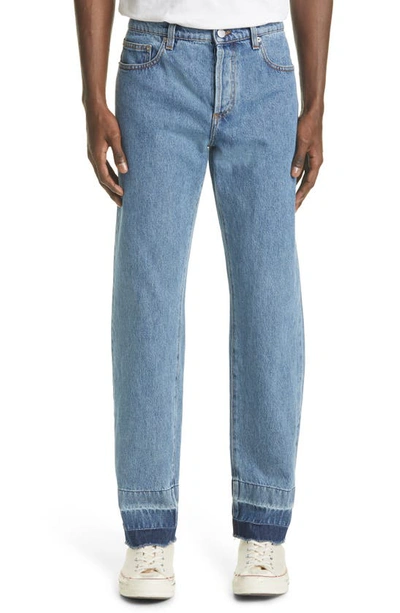 Shop Jw Anderson Raw Hem Slim Jeans In Denim Blue