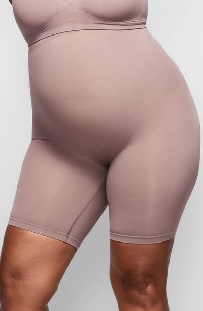 Shop Skims Sculpting Mid Thigh Shorts In Umber