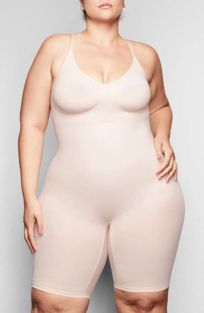 Shop Skims Sculpting Seamless Mid Thigh Bodysuit In Mica