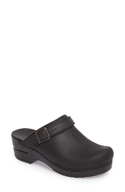 Shop Dansko Ingrid Clog In Black Oiled Leather