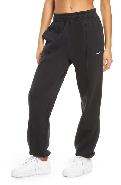 Nike Embroidered Cotton-blend Fleece Track Pants In Black