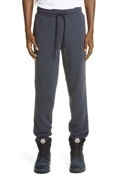 Shop Moncler Logo Embroidered Joggers In Navy