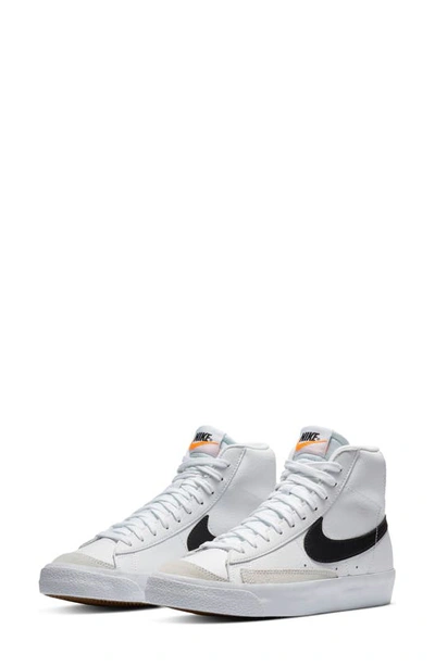 Shop Nike Kids' Blazer Mid '77 Vintage Sneaker In White/ Black/ Orange