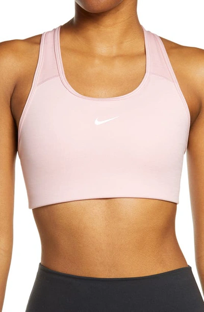 Shop Nike Swoosh Dri-fit Racerback Sports Bra In Pink Glaze/ Pure/ White