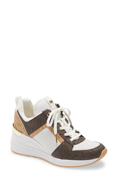 Shop Michael Michael Kors Georgie Wedge Sneaker In Optic White/ Brown Multi
