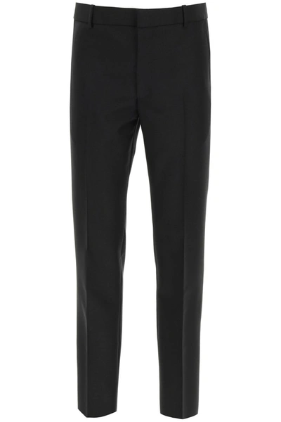 Shop Alexander Mcqueen Tailored Wool Trousers In Black