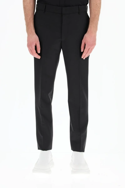 Shop Alexander Mcqueen Tailored Wool Trousers In Black