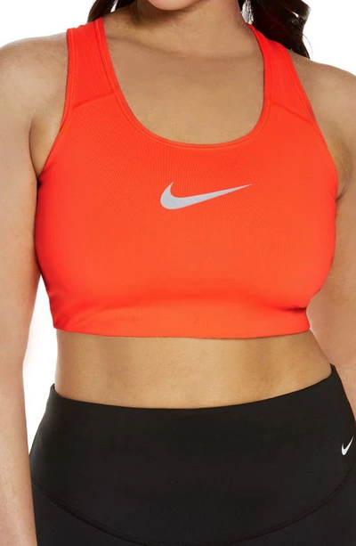 Shop Nike Dry Swoosh Bold Sports Bra In Bright Mango/ White