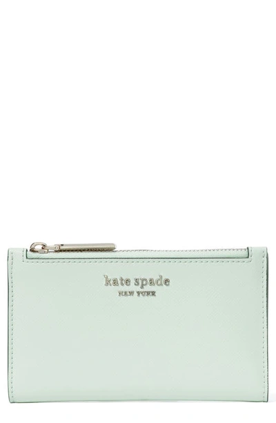 Shop Kate Spade Small Spencer Slim Leather Bifold Wallet In Crystal Blue