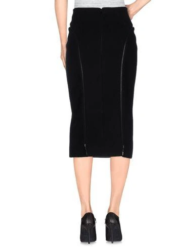 Shop Alaïa 3/4 Length Skirt In Black