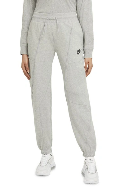 Shop Nike Sportswear Tapered Fleece Sweatpants In Dark Grey Heather/ Black