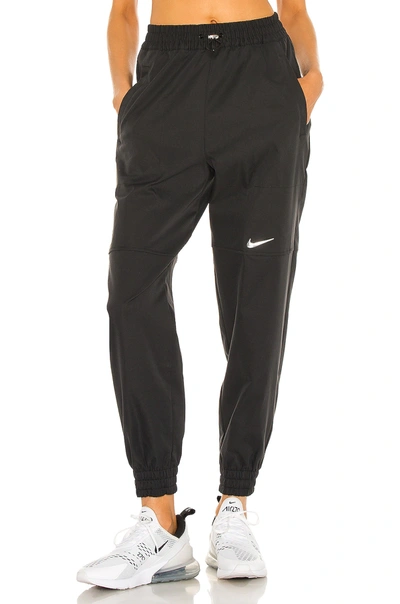 Shop Nike Nsw Swoosh Woven Pant In Black