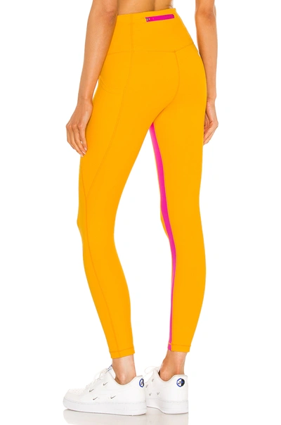 Shop All Access Ultra High Rise Utility Pocket Legging In Escape Orange & Digital Pink