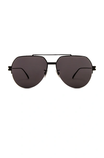 Shop Bottega Veneta Lock Pilot Sunglasses In Shiny Black & Grey