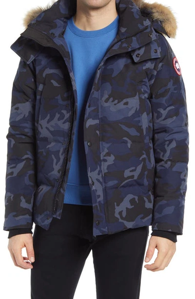 Shop Canada Goose Wyndham 625 Fill Power Down Jacket With Genuine Coyote Fur Trim In Classic Camo Navy