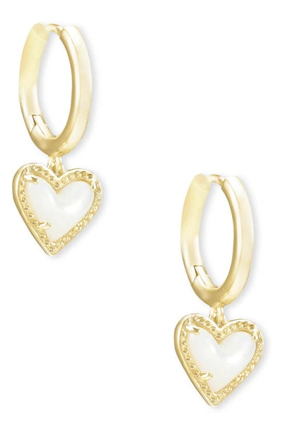 Shop Kendra Scott Ari Heart Huggie Hoop Earrings In Gold/ Ivory Mother Of Pearl