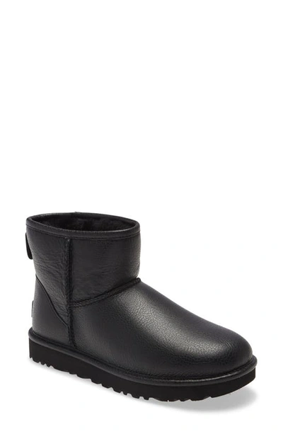 Shop Ugg Classic Mini Ii Genuine Shearling Lined Boot In Black Leather