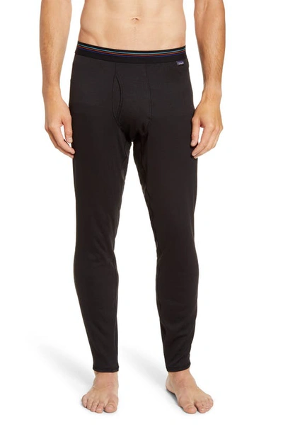 Shop Patagonia Capilene Midweight Base Layer Tights In Black