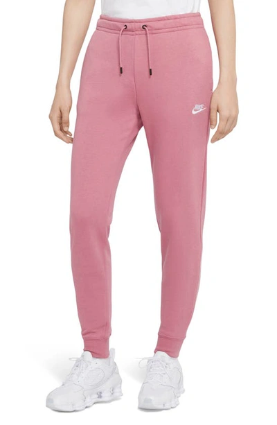 Shop Nike Sportswear Essential Fleece Pants In Desert Berry/ White