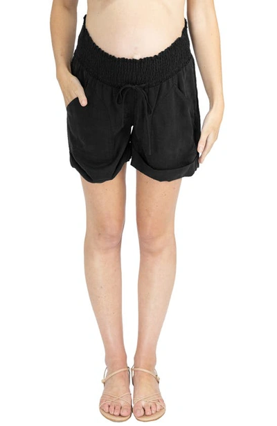 Shop Angel Maternity Smocked Waist Tencel® Maternity Shorts In Black