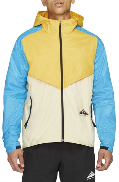 Shop Nike Windrunner Packable Jacket In Solar Flare/ Laser Blue/ Black