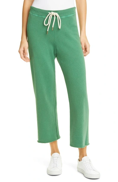 Shop The Great The Wide Leg Cropped Sweatpants In Bottle Green
