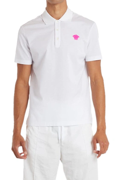 Shop Versace Medusa Applique Cotton Polo Shirt In White Fuxia