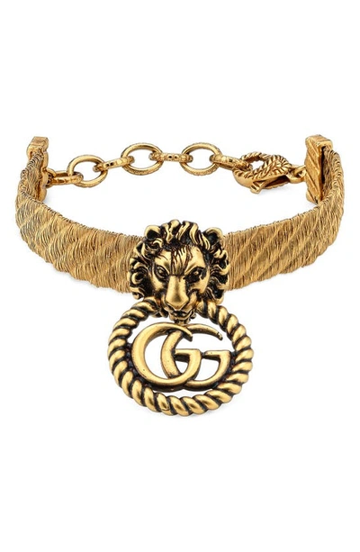 Shop Gucci Gg Lion Head Bracelet In Gold