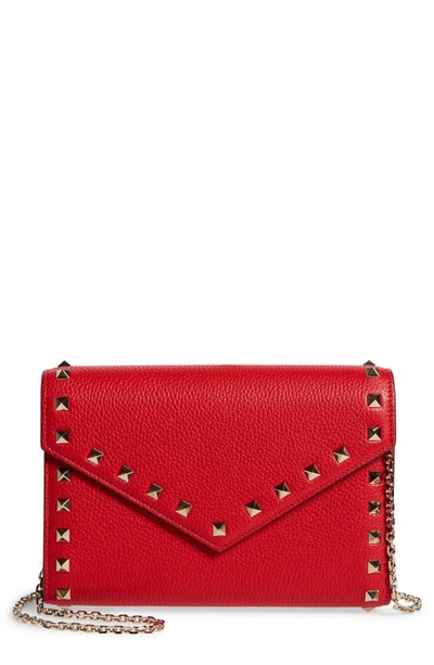 Shop Valentino Rockstud Leather Envelope Wallet On A Chain In Rouge Pur